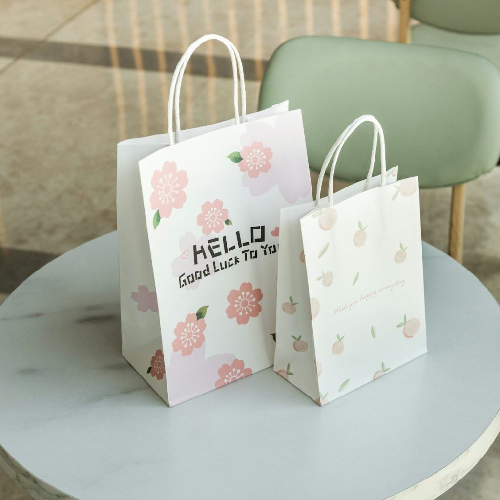 a couple of shopping bags on a table